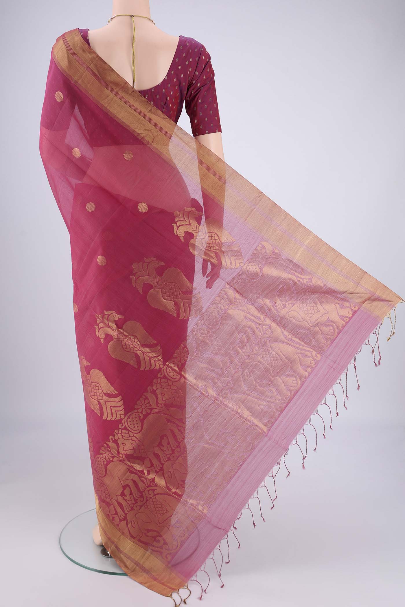 Flat view of Pink Silk Cotton Saree with Zari Butta on the body and Zari Border. 