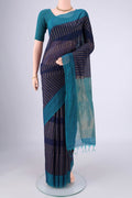 Navy Blue Silk Cotton Saree with Zari Butta on the body and Plain Border.  displayed on a mannequin