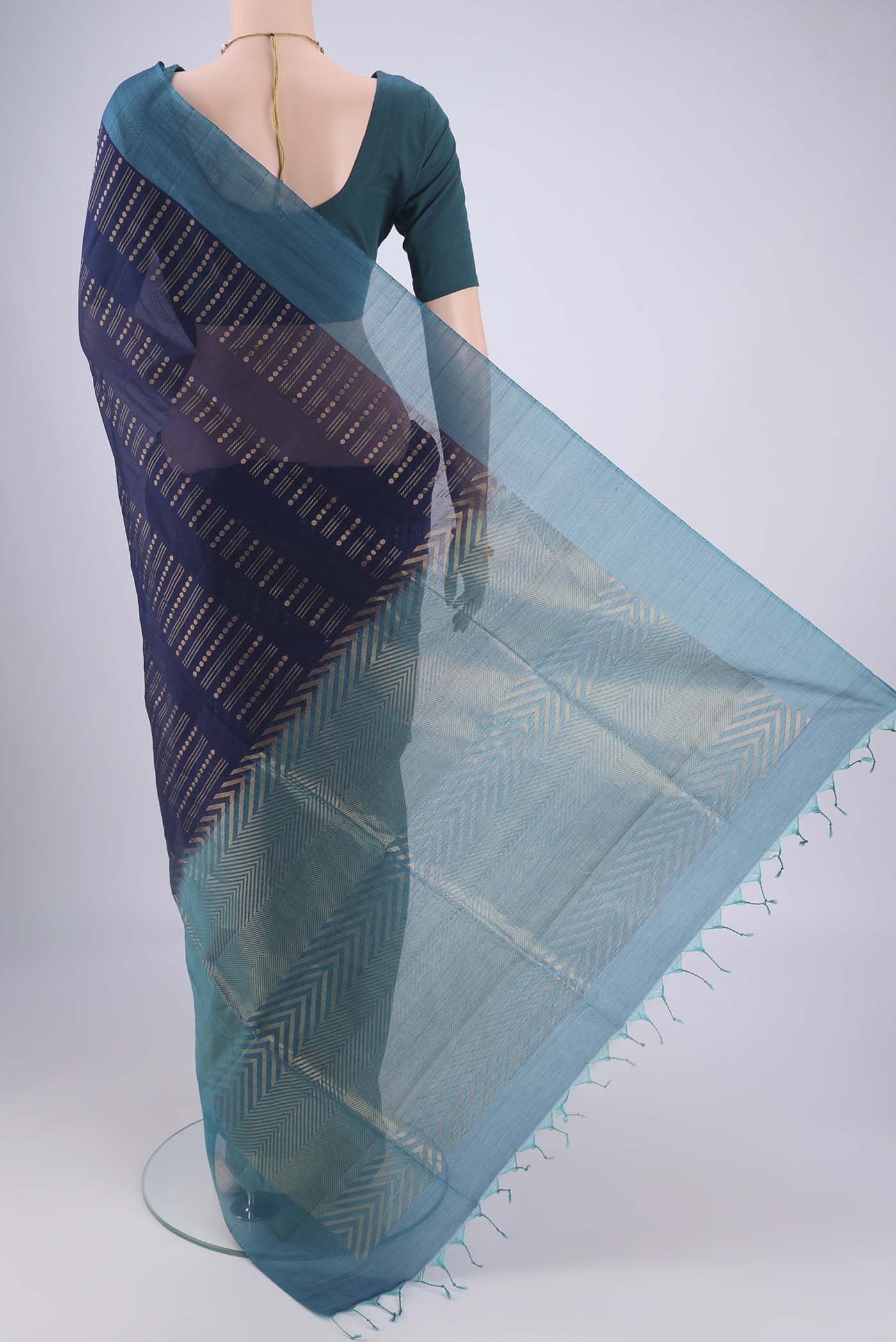 Flat view of Navy Blue Silk Cotton Saree with Zari Butta on the body and Plain Border. 