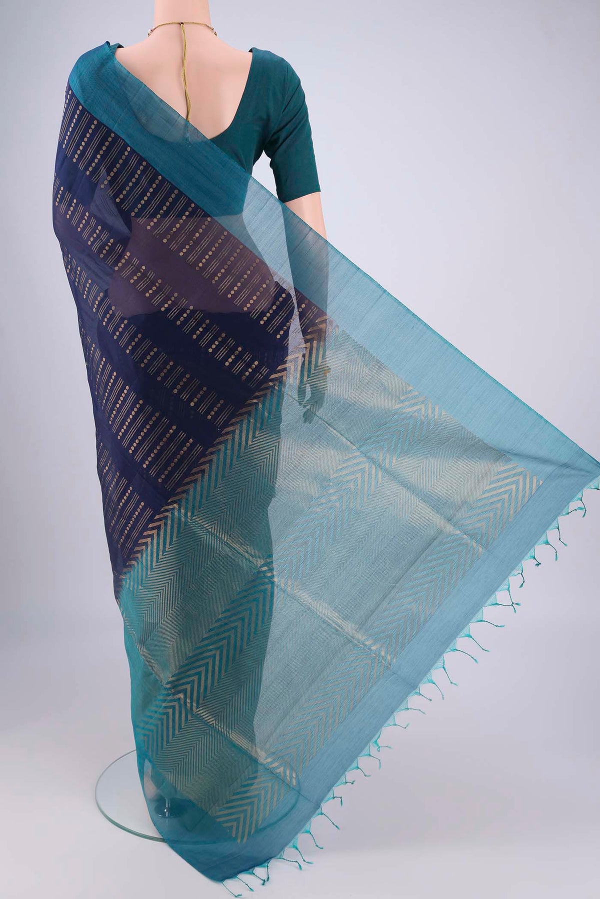 Flat view of Navy Blue Silk Cotton Saree with Zari Butta on the body and Plain Border. 