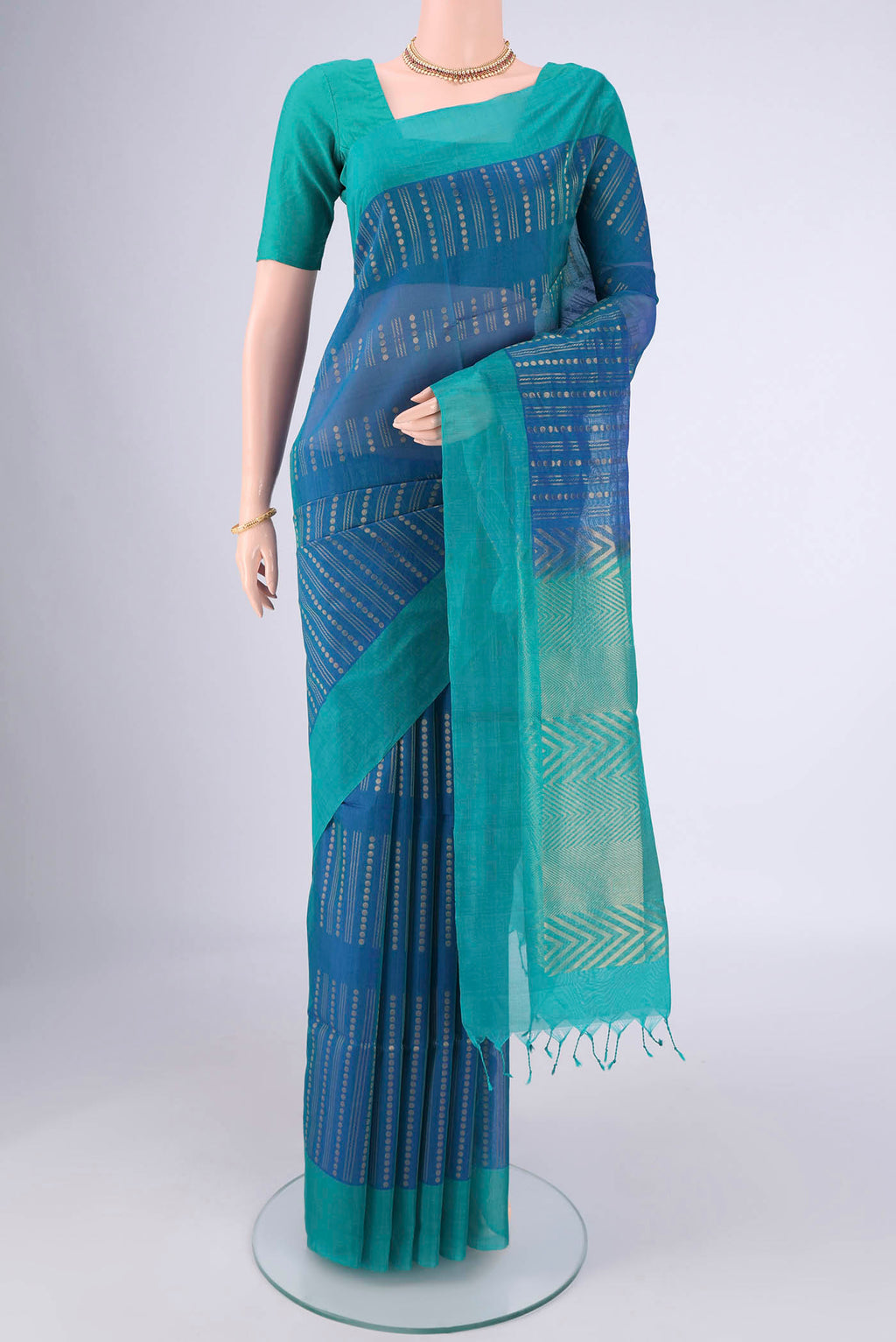 Blue Silk Cotton Saree with Zari Butta on the body and Plain Border.  displayed on a mannequin