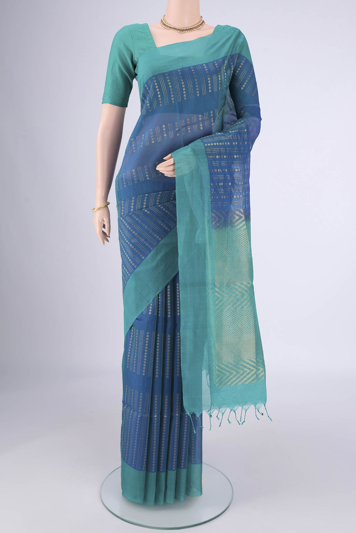 Blue Silk Cotton Saree with Zari Butta on the body and Plain Border.  displayed on a mannequin