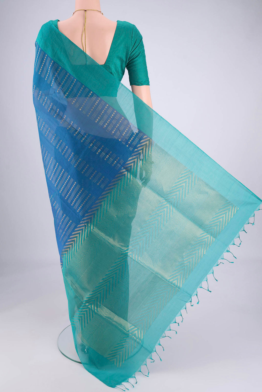 Flat view of Blue Silk Cotton Saree with Zari Butta on the body and Plain Border. 