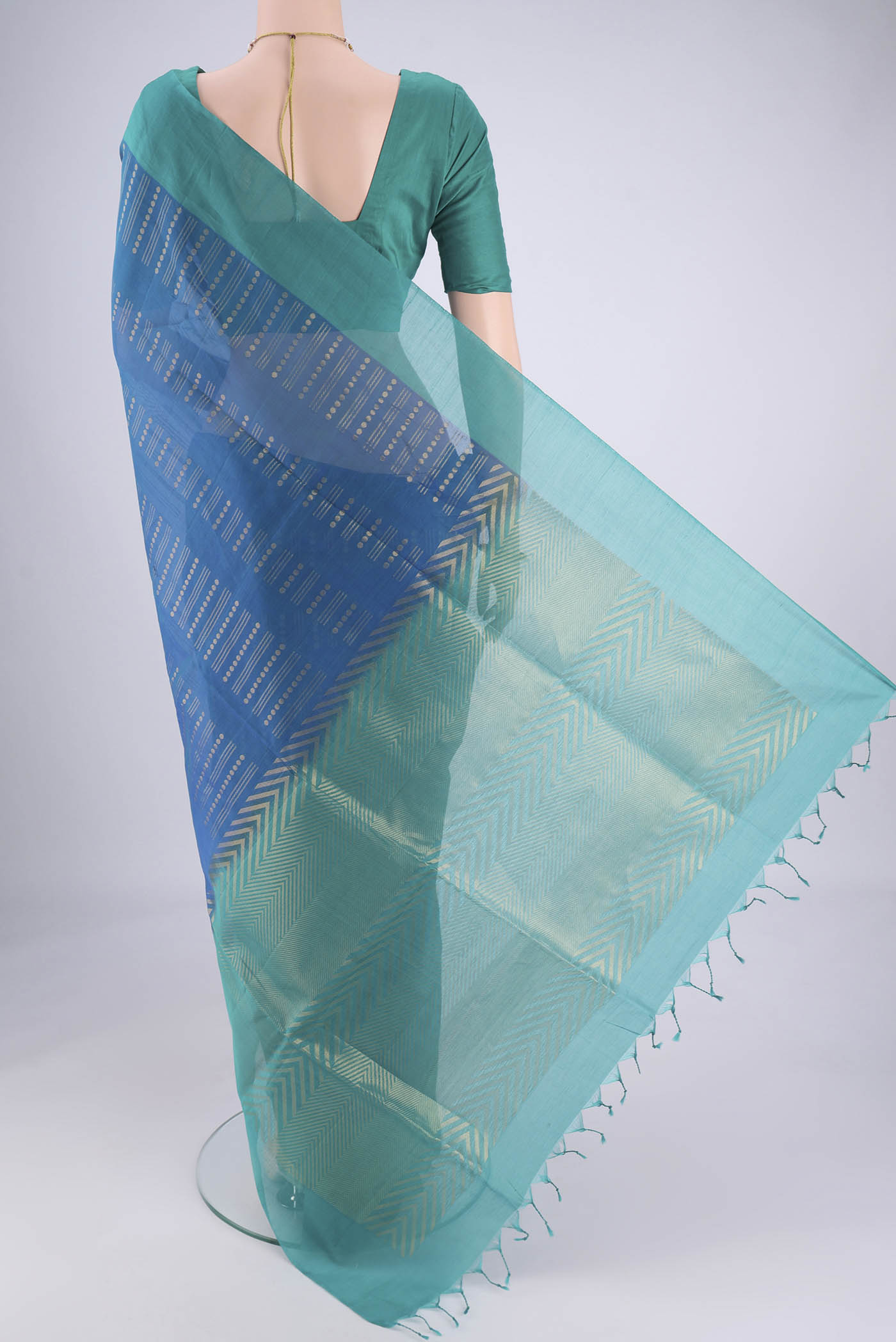 Flat view of Blue Silk Cotton Saree with Zari Butta on the body and Plain Border. 