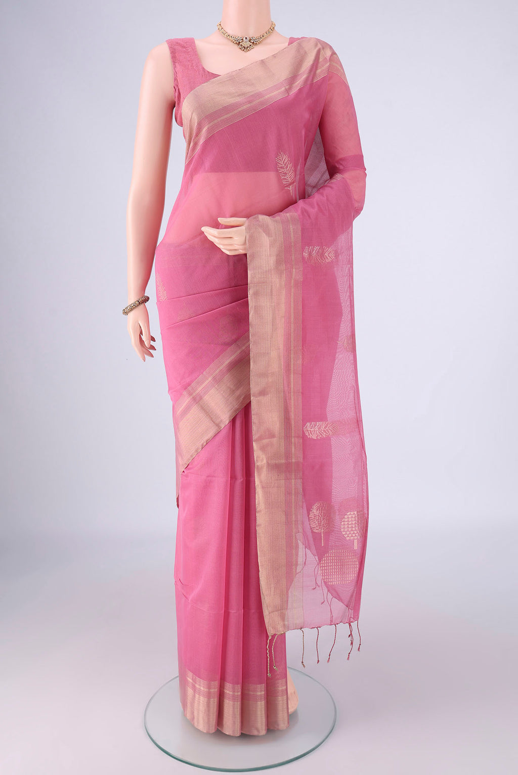 Rose pink Silk Cotton Saree with Zari Butta on the body and Zari Border.  displayed on a mannequin