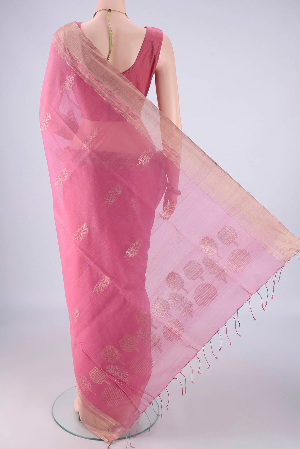 Flat view of Rose pink Silk Cotton Saree with Zari Butta on the body and Zari Border. 