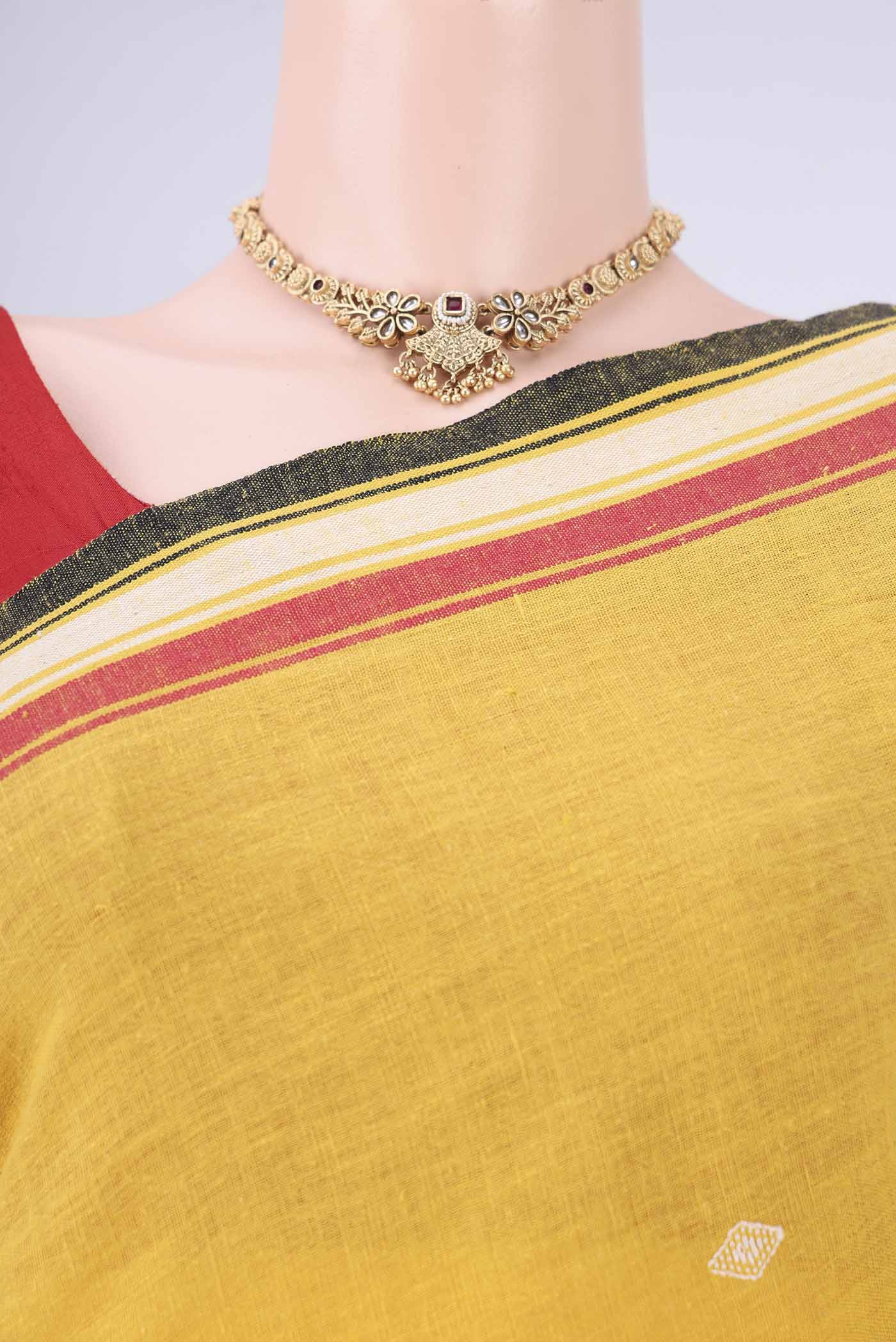Border image of Gold with Red Dual Tone Khadi Cotton Saree with Thread Butta on the body and Plain Border. 