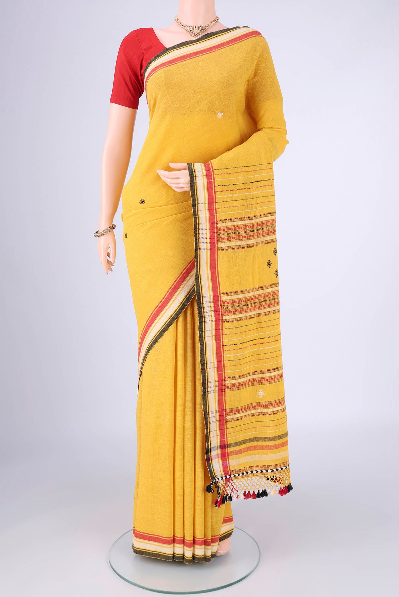 Gold with Red Dual Tone Khadi Cotton Saree with Thread Butta on the body and Plain Border.  displayed on a mannequin