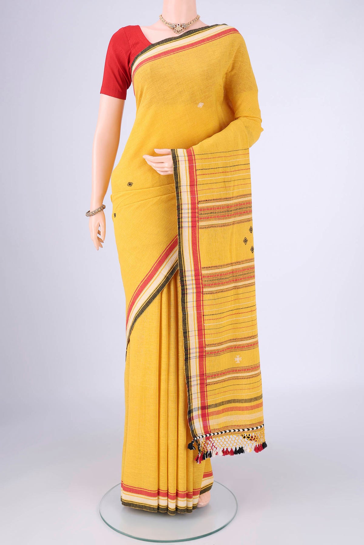 Gold with Red Dual Tone Khadi Cotton Saree with Thread Butta on the body and Plain Border.  displayed on a mannequin