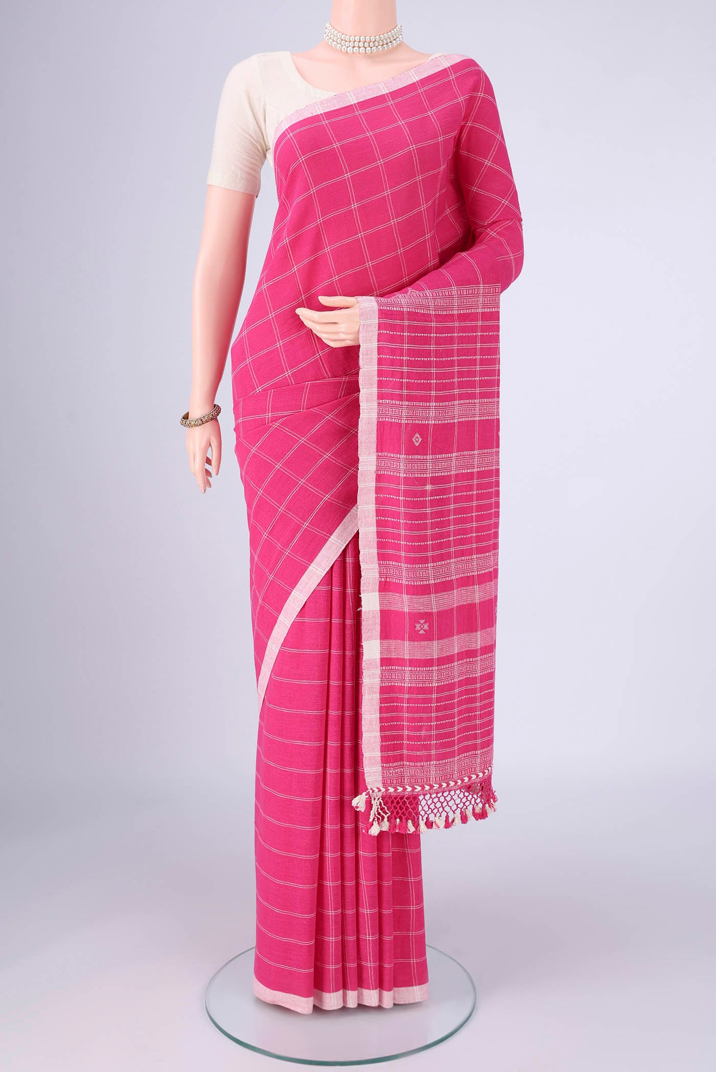 Pink Khadi Cotton Saree with Stripes on the body and Plain Border.  displayed on a mannequin