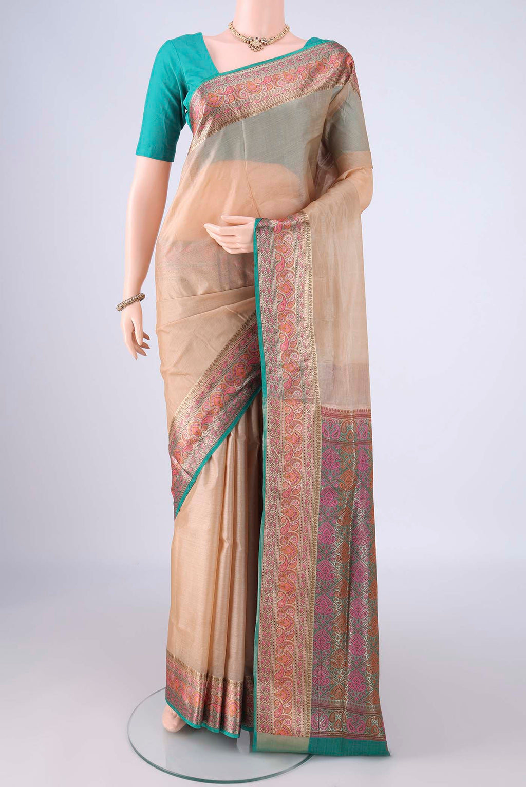 Beige Banarasi Tussar Silk Saree with Plain Body and Zari Border.  displayed on a mannequin