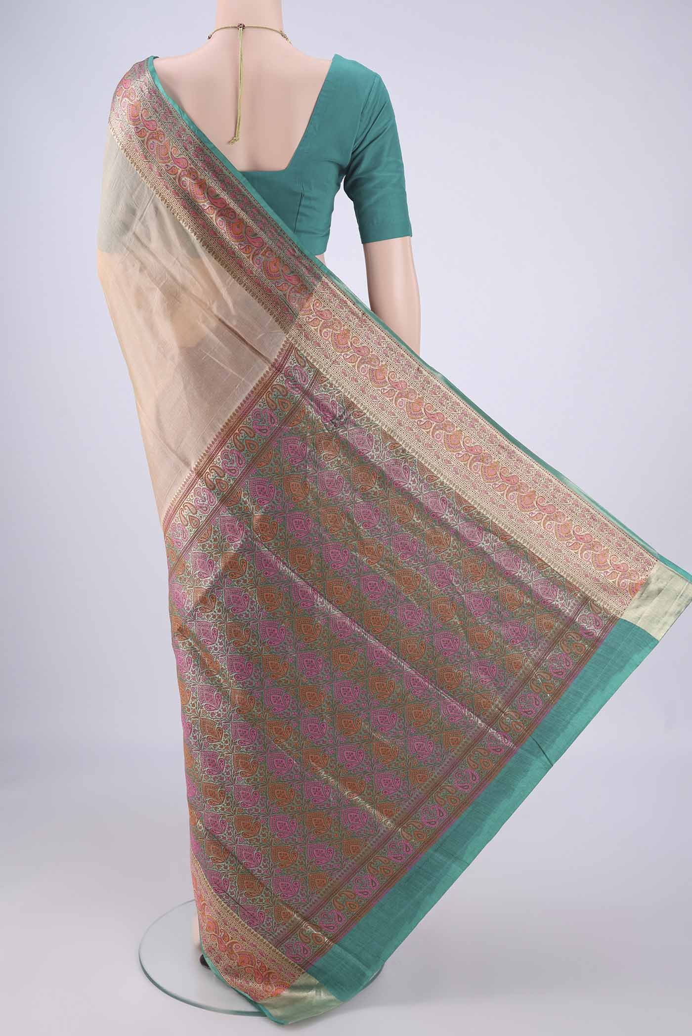 Flat view of Beige Banarasi Tussar Silk Saree with Plain Body and Zari Border. 