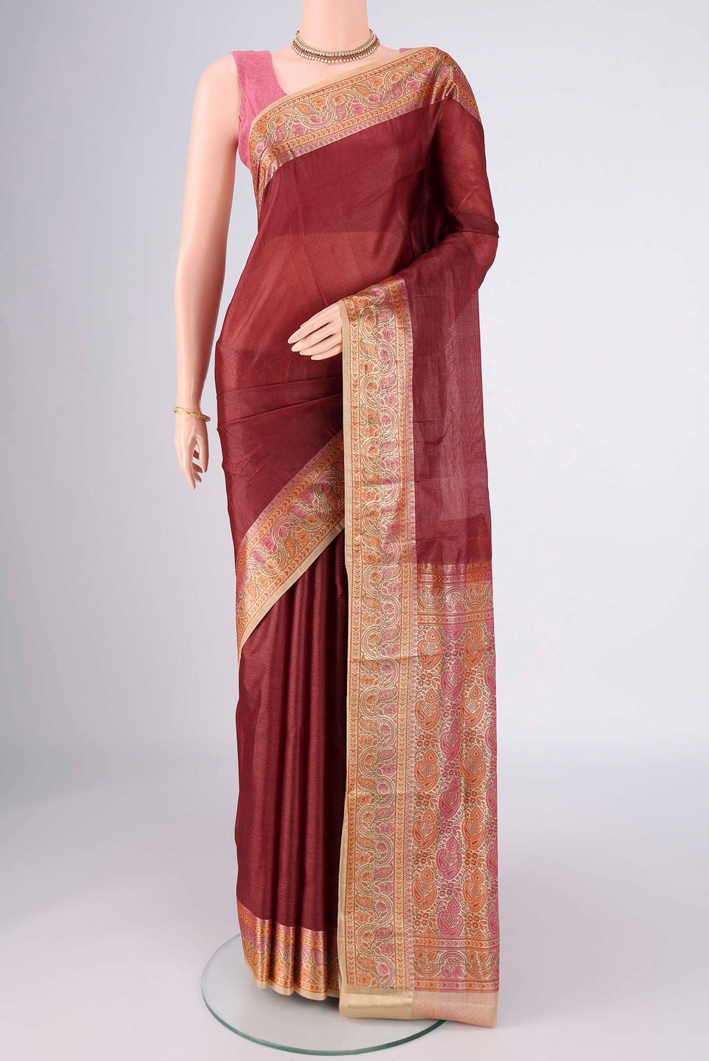 Brown Banarasi Tussar Silk Saree with Plain Body and Zari Border.  displayed on a mannequin
