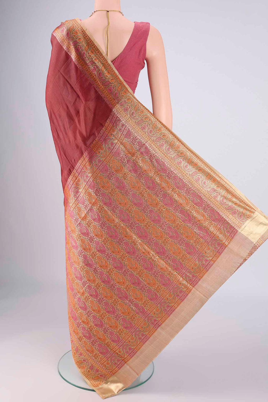Flat view of Brown Banarasi Tussar Silk Saree with Plain Body and Zari Border. 