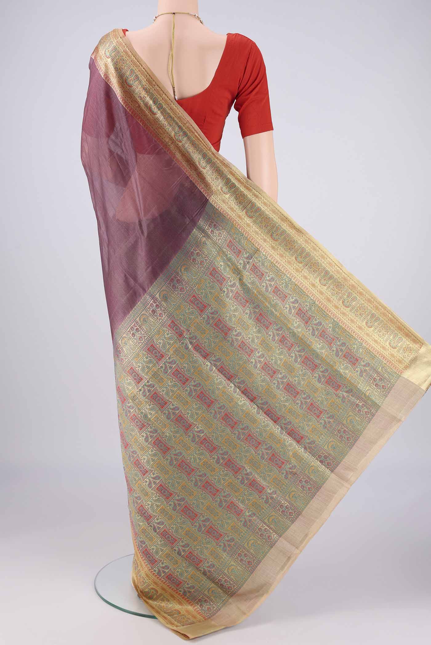Flat view of Dark Mauve Banarasi Tussar Silk Saree with Plain Body and Zari Border. 