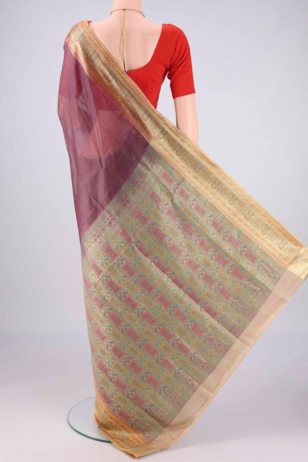Flat view of Dark Mauve Banarasi Tussar Silk Saree with Plain Body and Zari Border. 