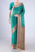 Sea Green Banarasi Tussar Silk Saree with Plain Body and Zari Border.  displayed on a mannequin