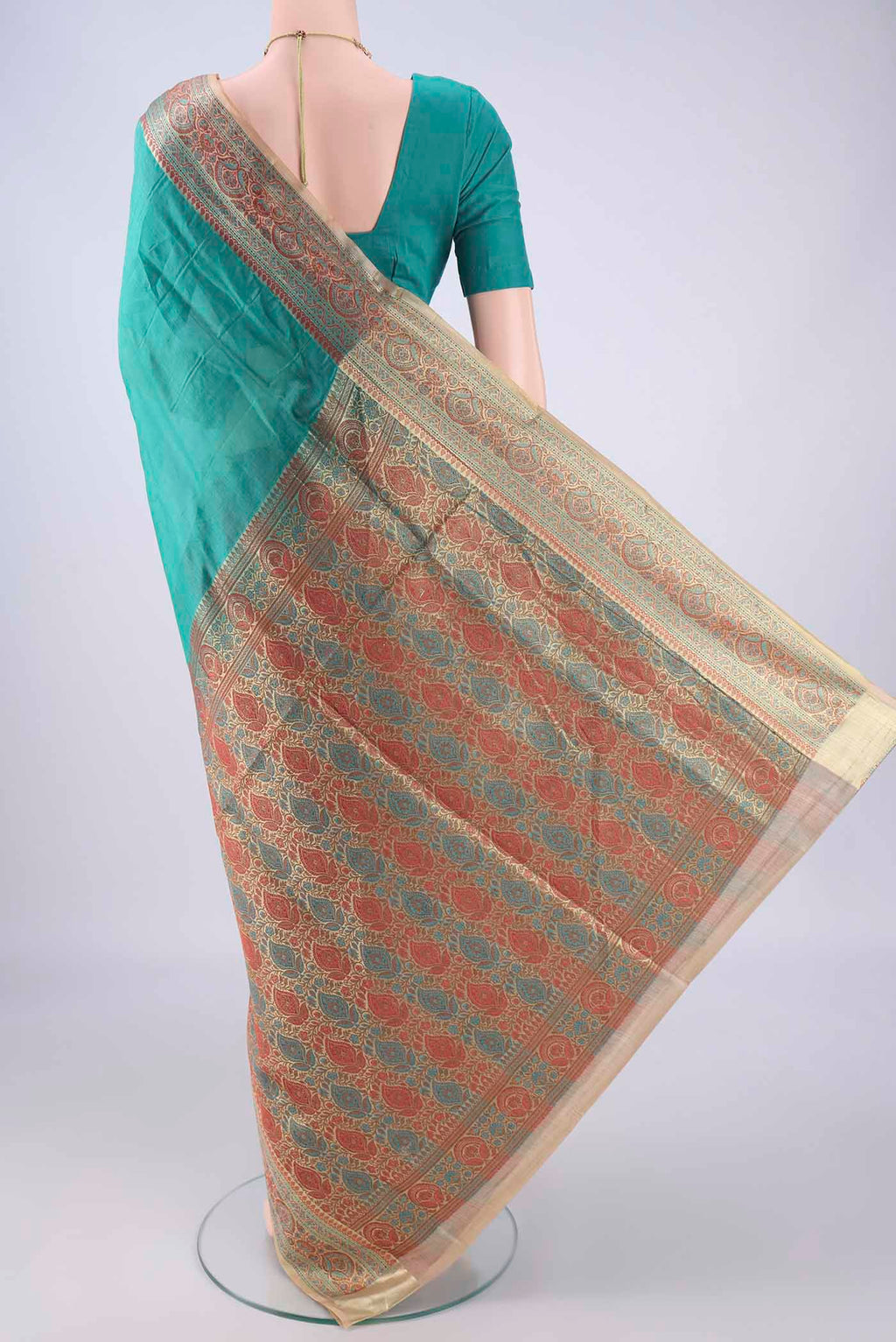 Flat view of Sea Green Banarasi Tussar Silk Saree with Plain Body and Zari Border. 