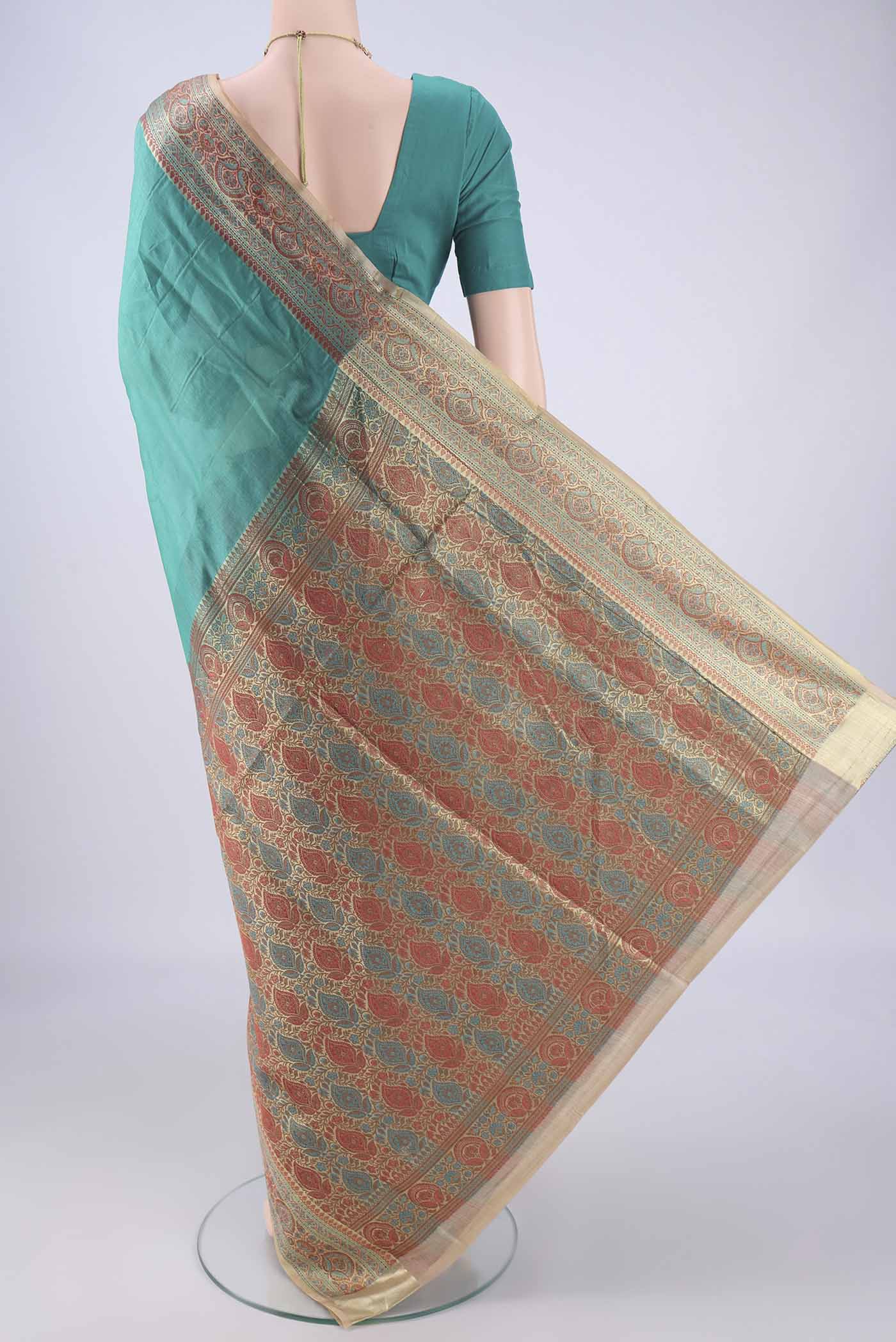 Flat view of Sea Green Banarasi Tussar Silk Saree with Plain Body and Zari Border. 