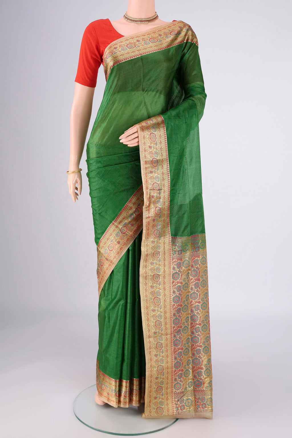 Green Banarasi Tussar Silk Saree with Plain Body and Zari Border.  displayed on a mannequin