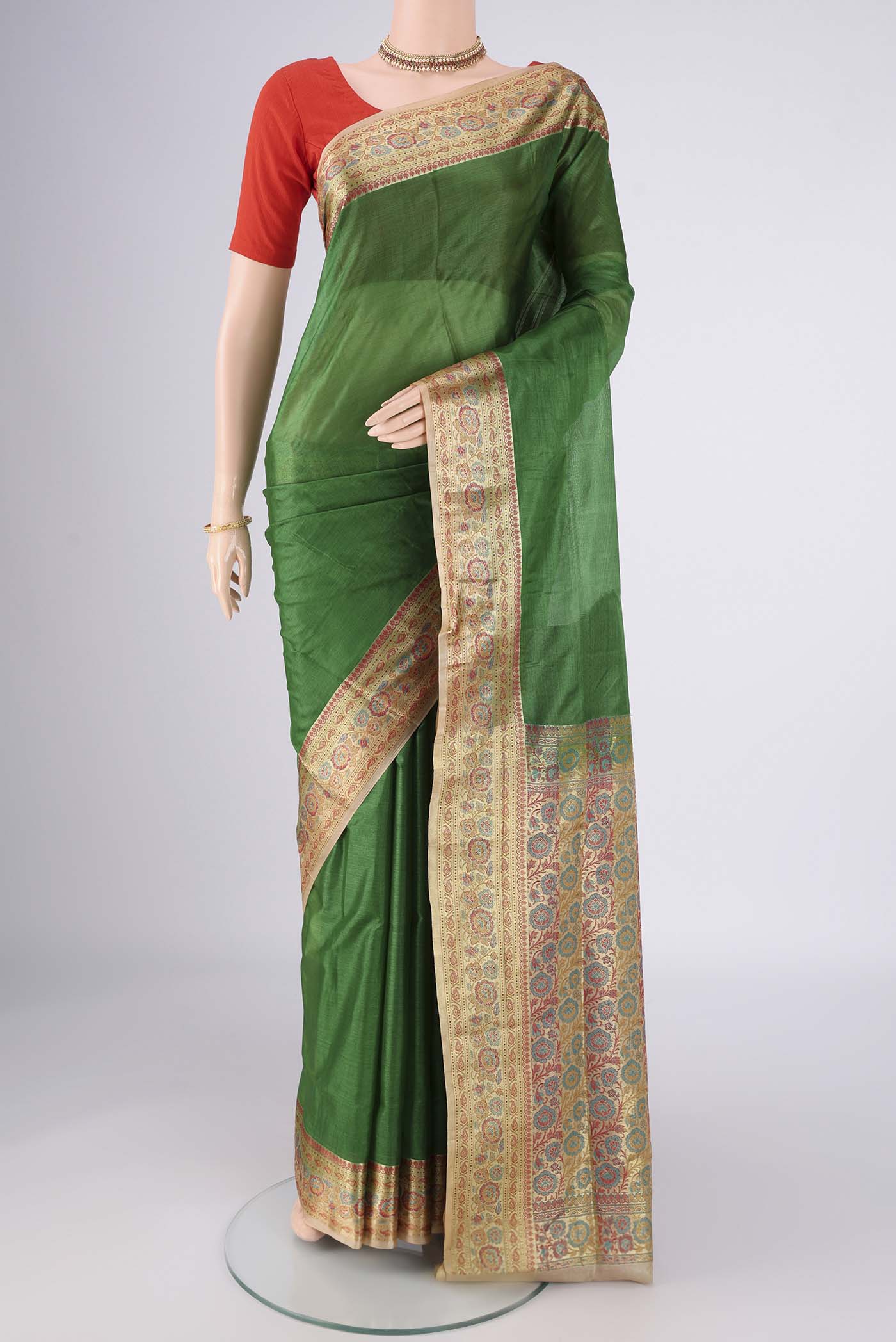 Green Banarasi Tussar Silk Saree with Plain Body and Zari Border.  displayed on a mannequin