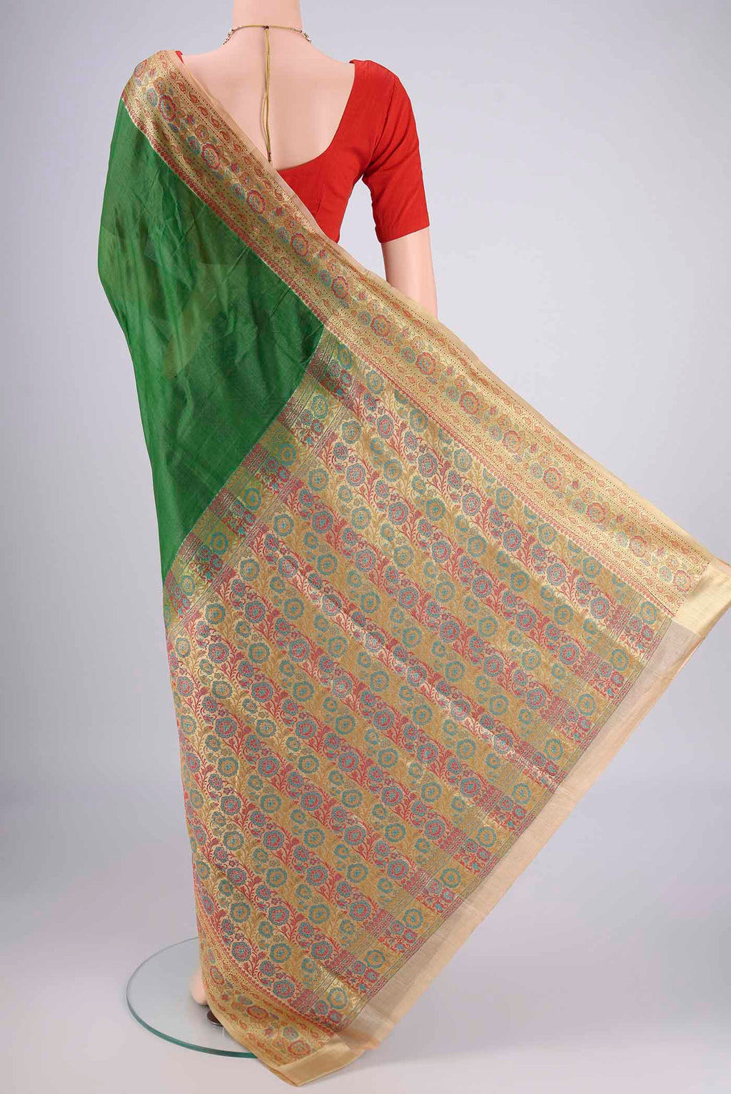 Flat view of Green Banarasi Tussar Silk Saree with Plain Body and Zari Border. 