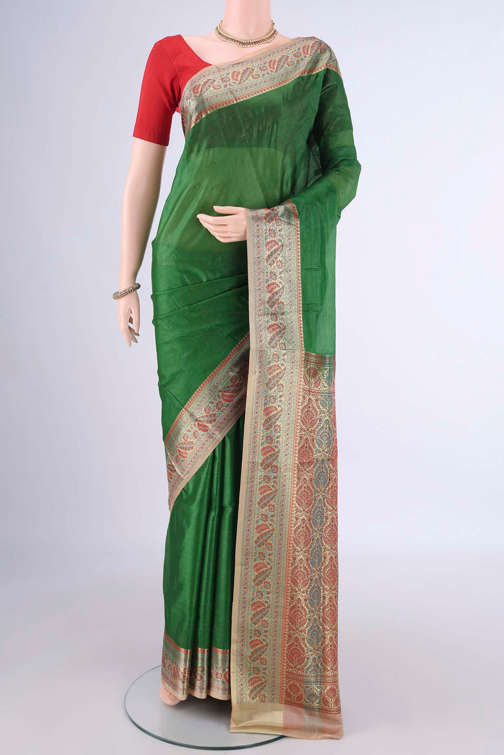 Green Banarasi Tussar Silk Saree with Plain Body and Zari Border.  displayed on a mannequin