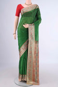 Green Banarasi Tussar Silk Saree with Plain Body and Zari Border.  displayed on a mannequin