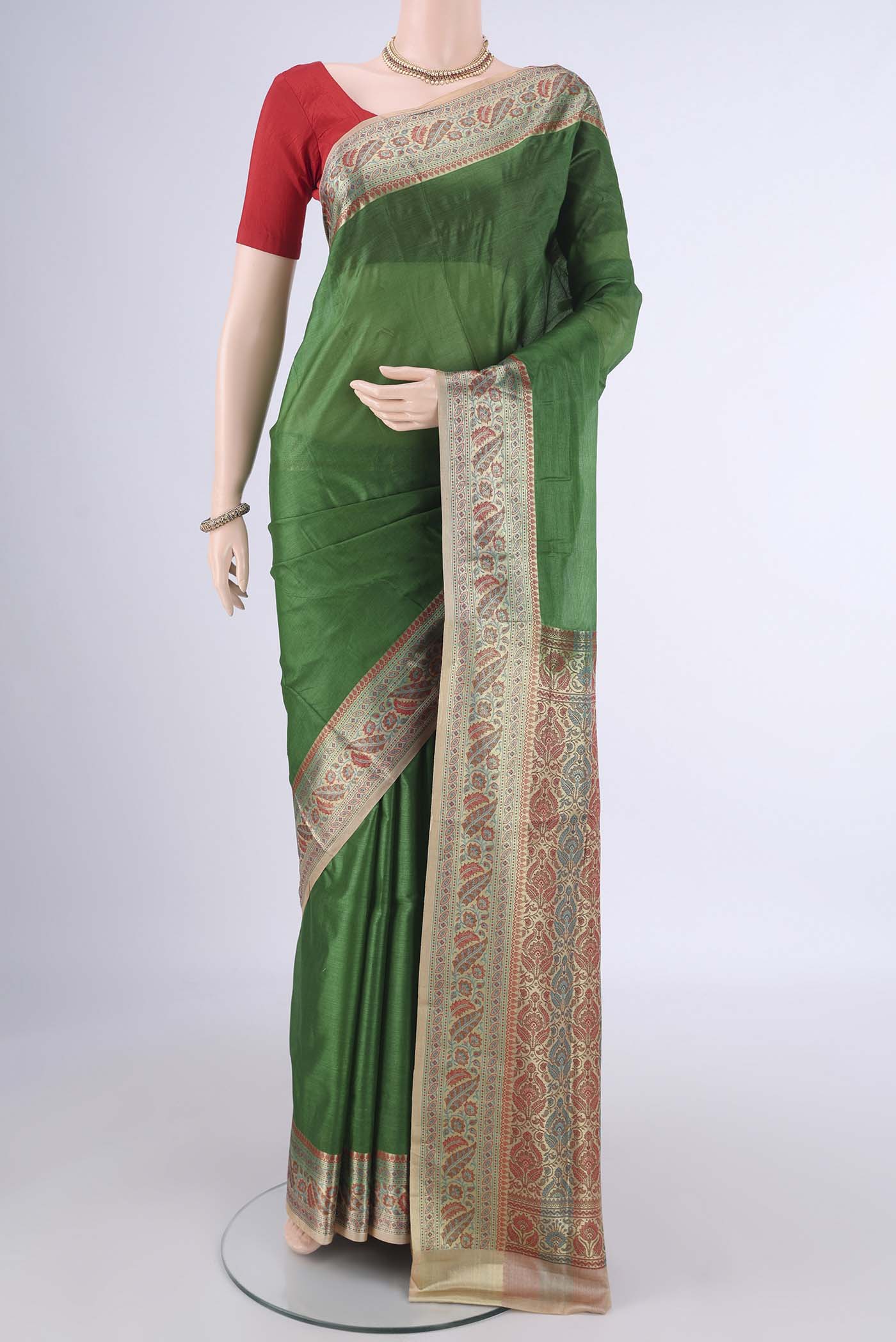 Green Banarasi Tussar Silk Saree with Plain Body and Zari Border.  displayed on a mannequin