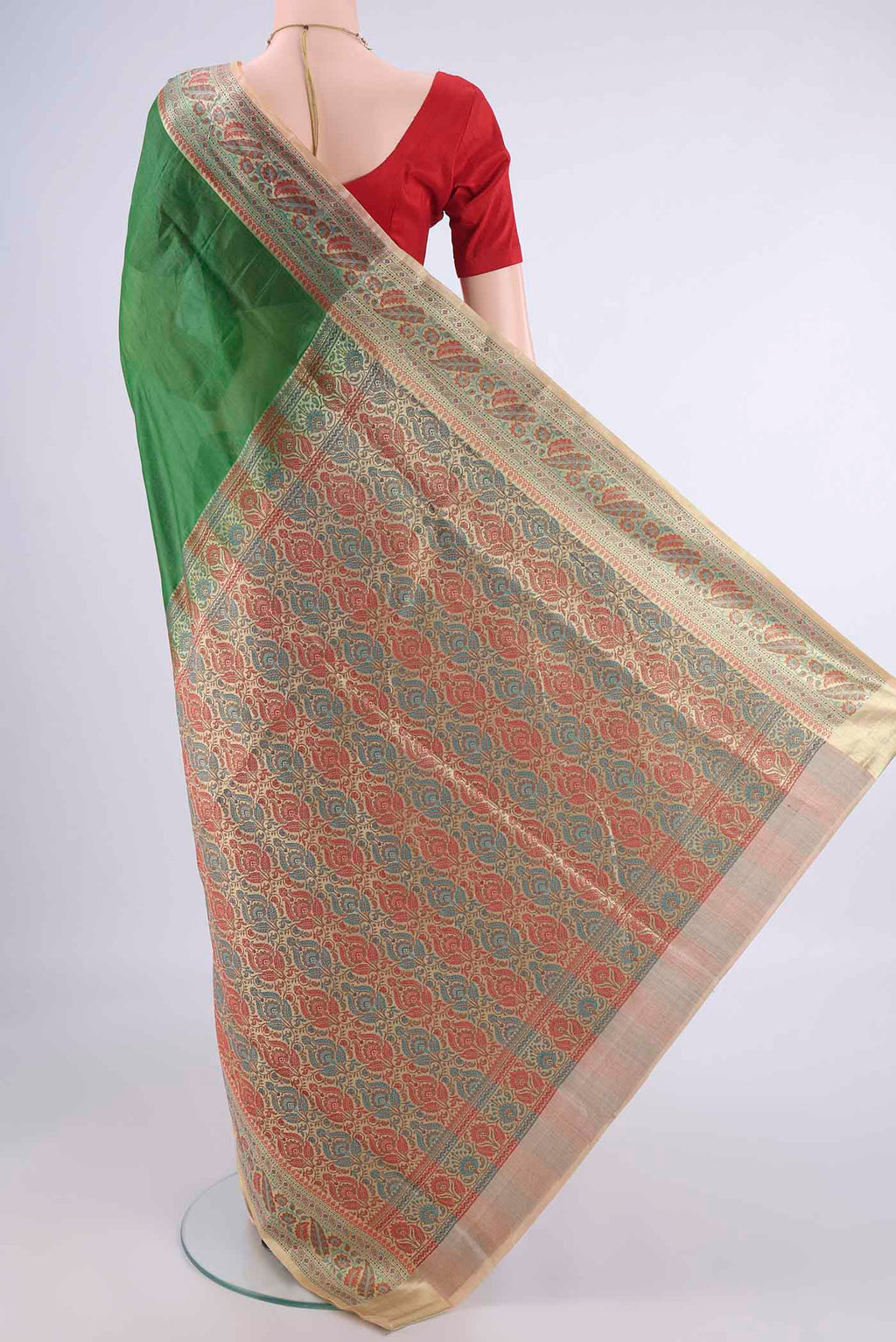 Flat view of Green Banarasi Tussar Silk Saree with Plain Body and Zari Border. 
