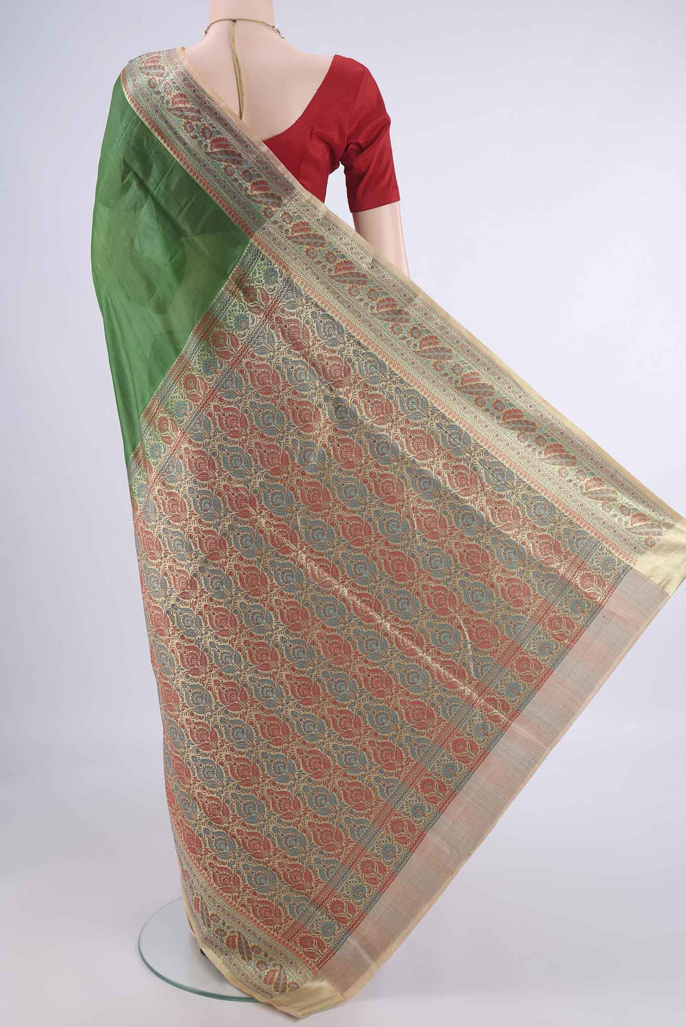 Flat view of Green Banarasi Tussar Silk Saree with Plain Body and Zari Border. 