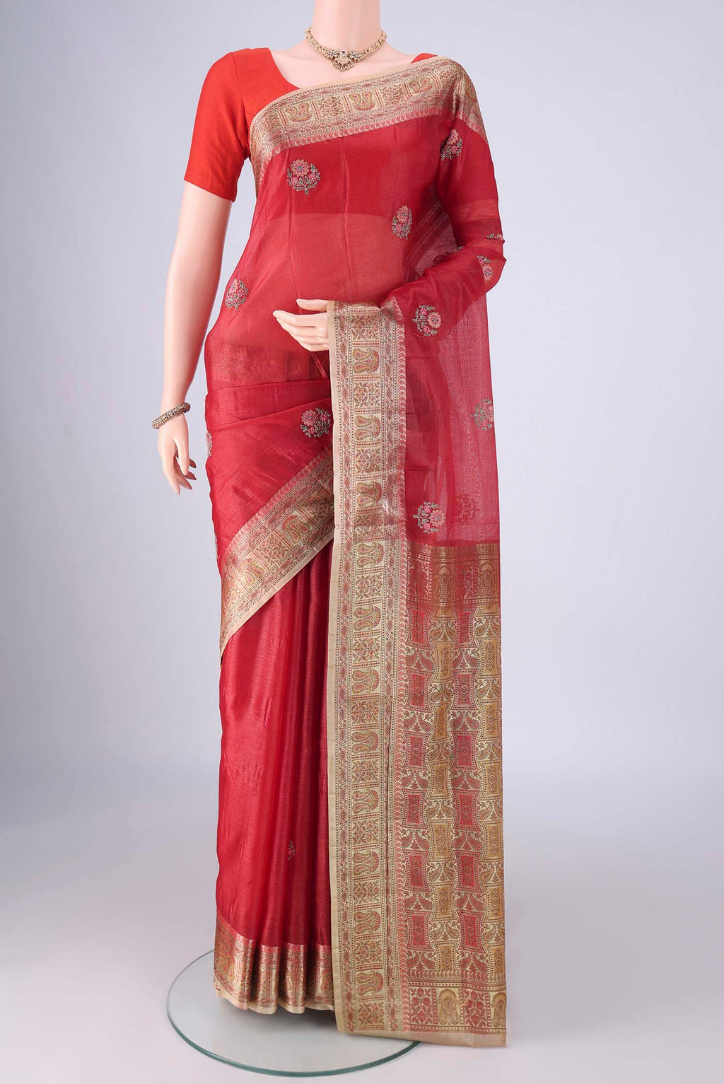 Red Banarasi Tussar Silk Saree with Embroidery on the body and Zari Border.  displayed on a mannequin