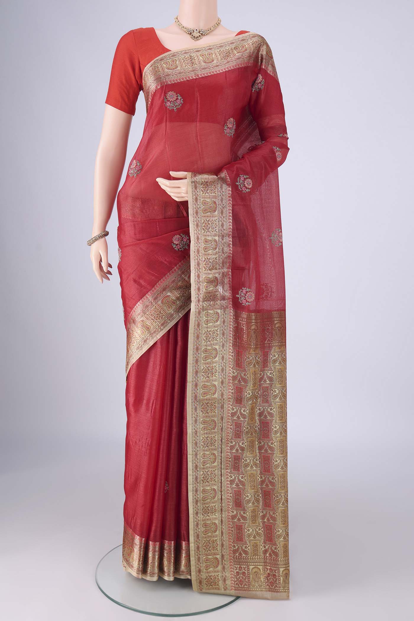 Red Banarasi Tussar Silk Saree with Embroidery on the body and Zari Border.  displayed on a mannequin