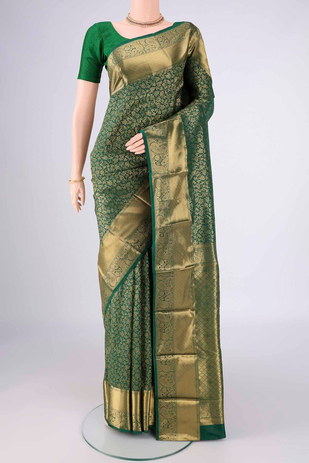 Bottle Green Bangalore Silk Saree with Zari Brocade on the body and Zari Border.  displayed on a mannequin