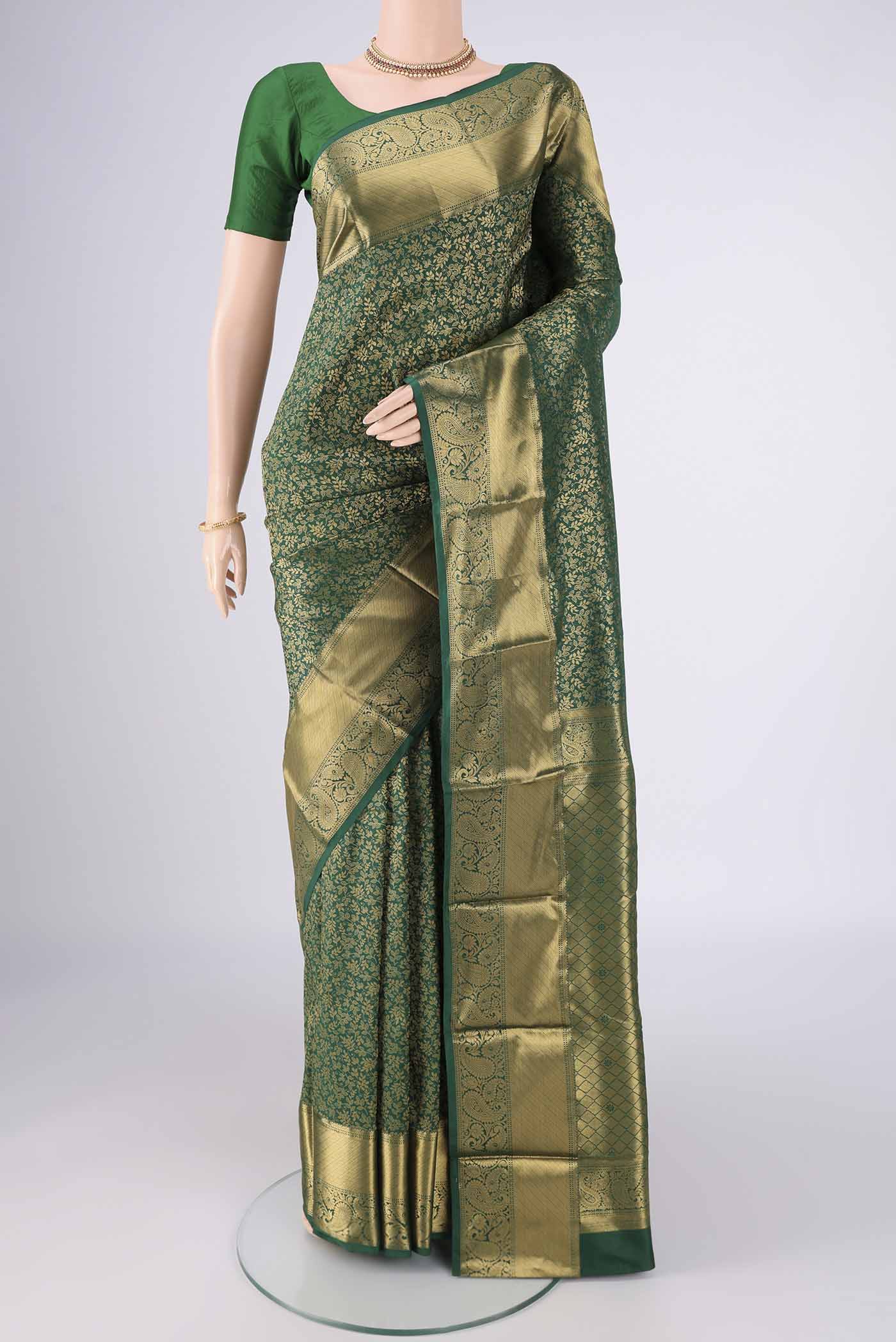 Bottle Green Bangalore Silk Saree with Zari Brocade on the body and Zari Border.  displayed on a mannequin