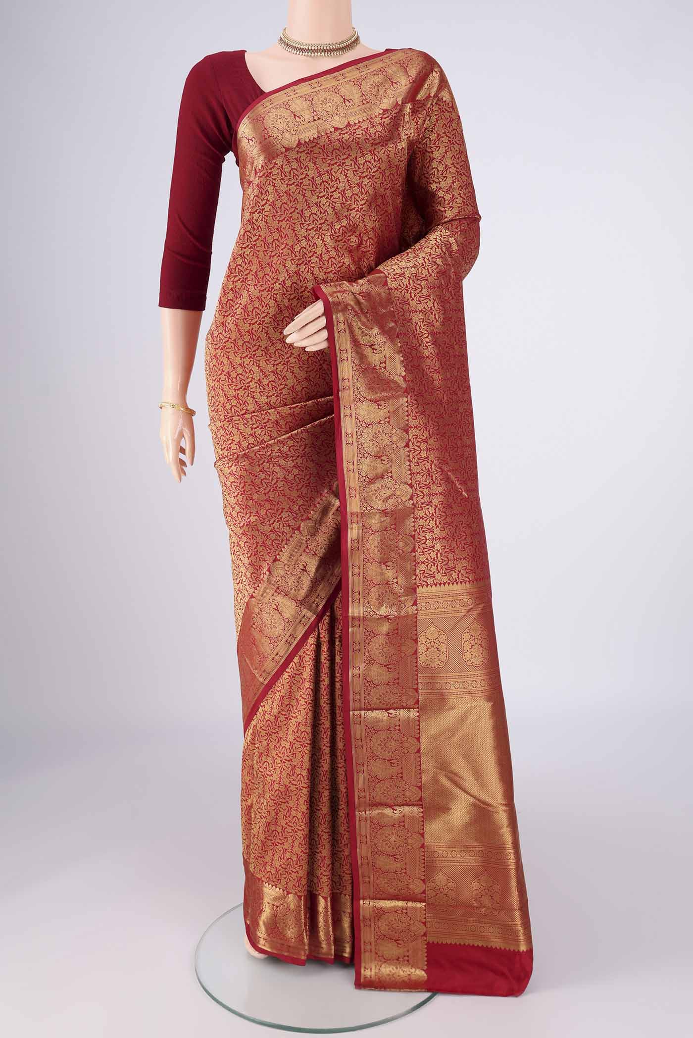 Maroon Bangalore Silk Saree with Zari Brocade on the body and Zari Border.  displayed on a mannequin