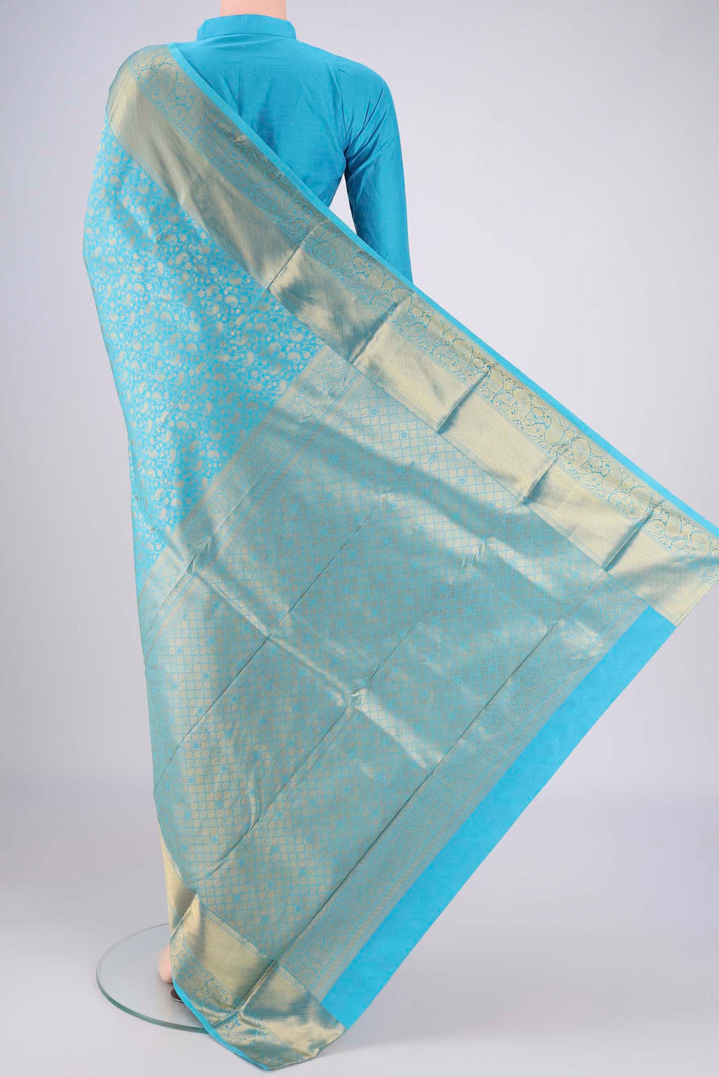 Flat view of Sky Blue Bangalore Silk Saree with Zari Brocade on the body and Zari Border. 