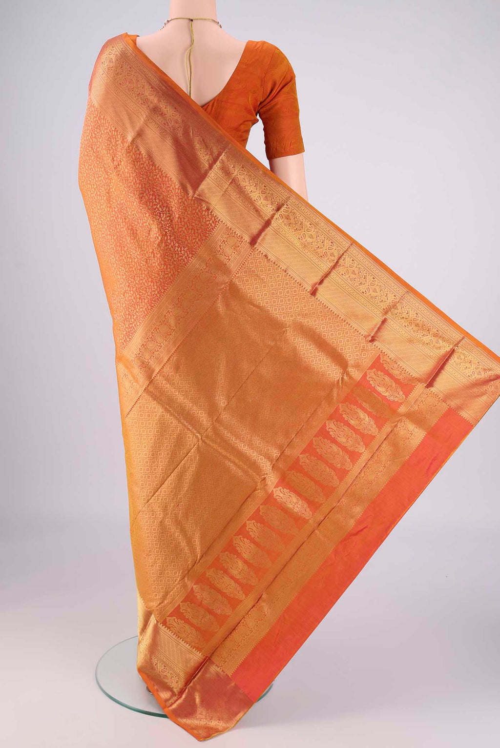 Flat view of Brick Orange Dual Tone Bangalore Silk Saree with Zari Brocade on the body and Zari Border. 