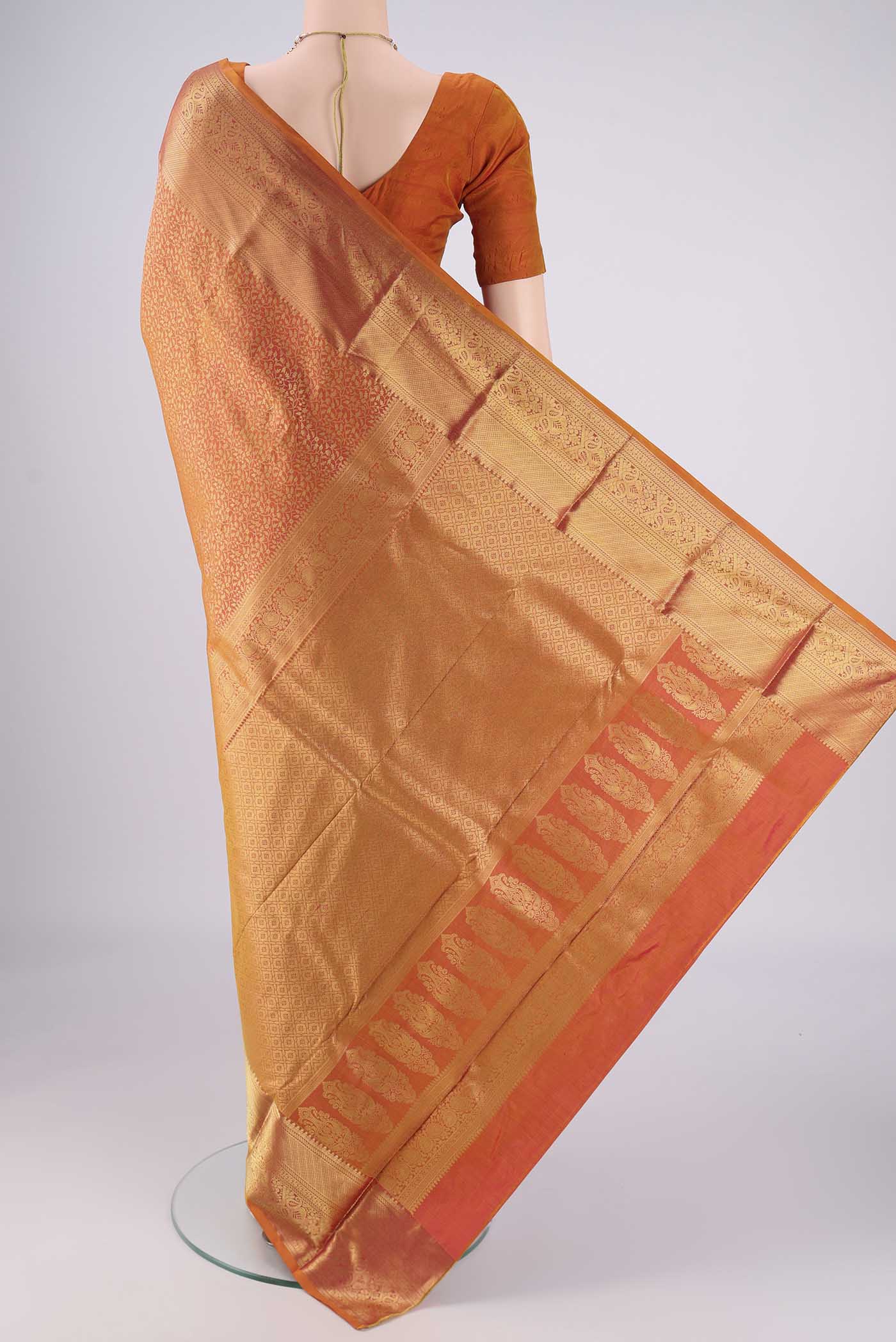 Flat view of Brick Orange Dual Tone Bangalore Silk Saree with Zari Brocade on the body and Zari Border. 