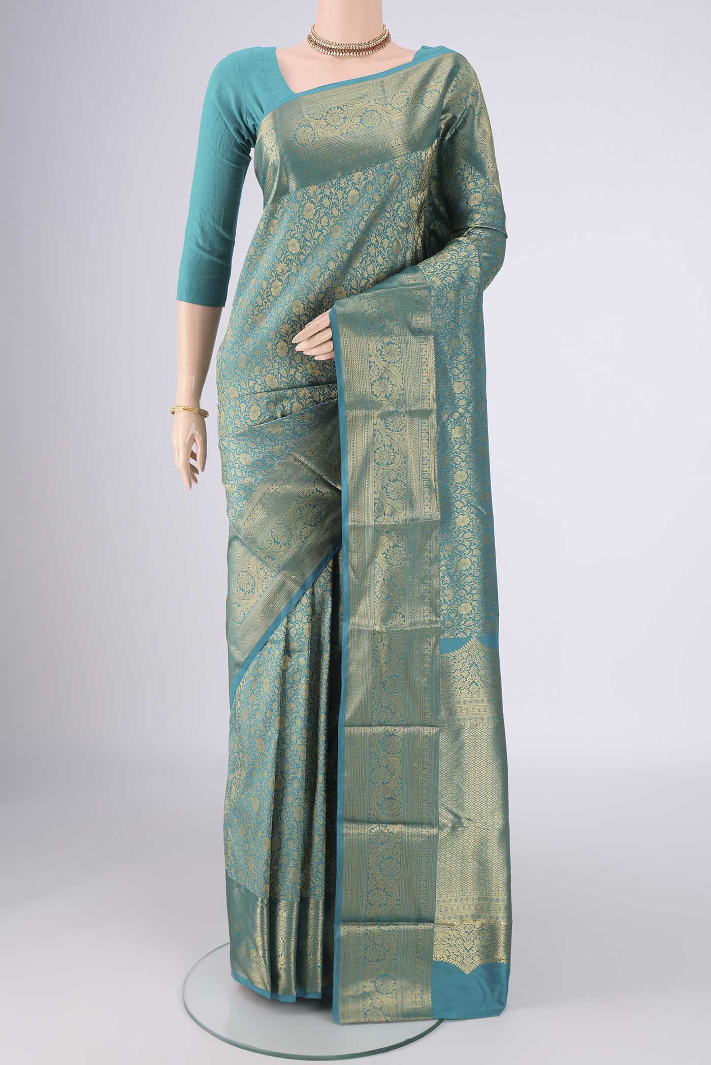 Turquoise Bangalore Silk Saree with Zari Brocade on the body and Zari Border.  displayed on a mannequin