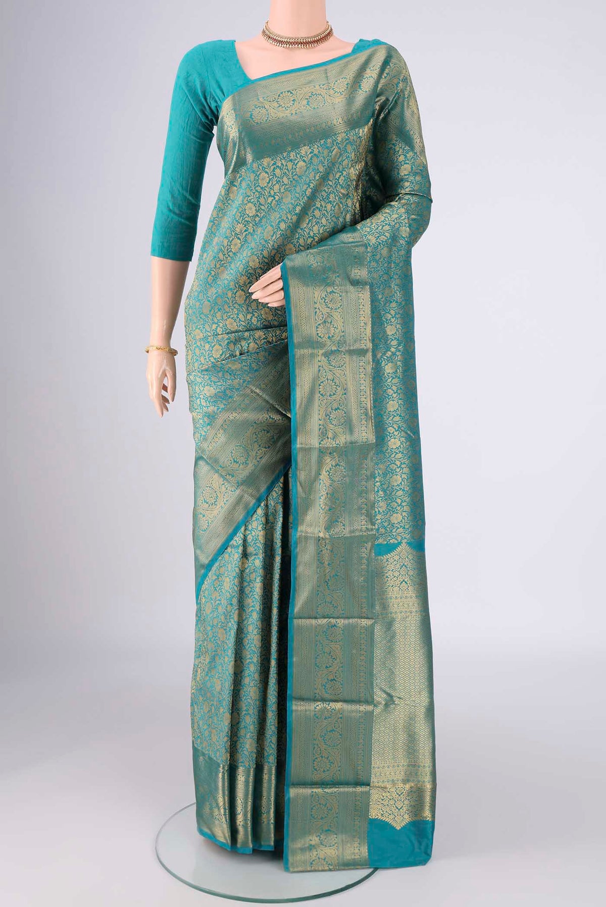 Turquoise Bangalore Silk Saree with Zari Brocade on the body and Zari Border.  displayed on a mannequin