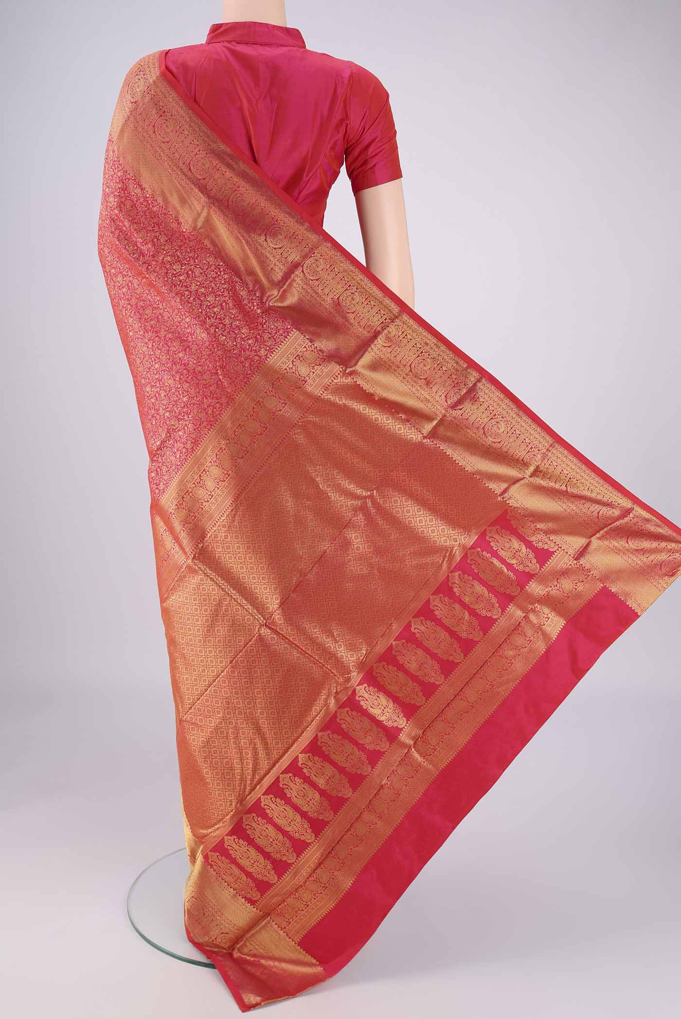 Flat view of Dark Pink Bangalore Silk Saree with Zari Brocade on the body and Zari Border. 
