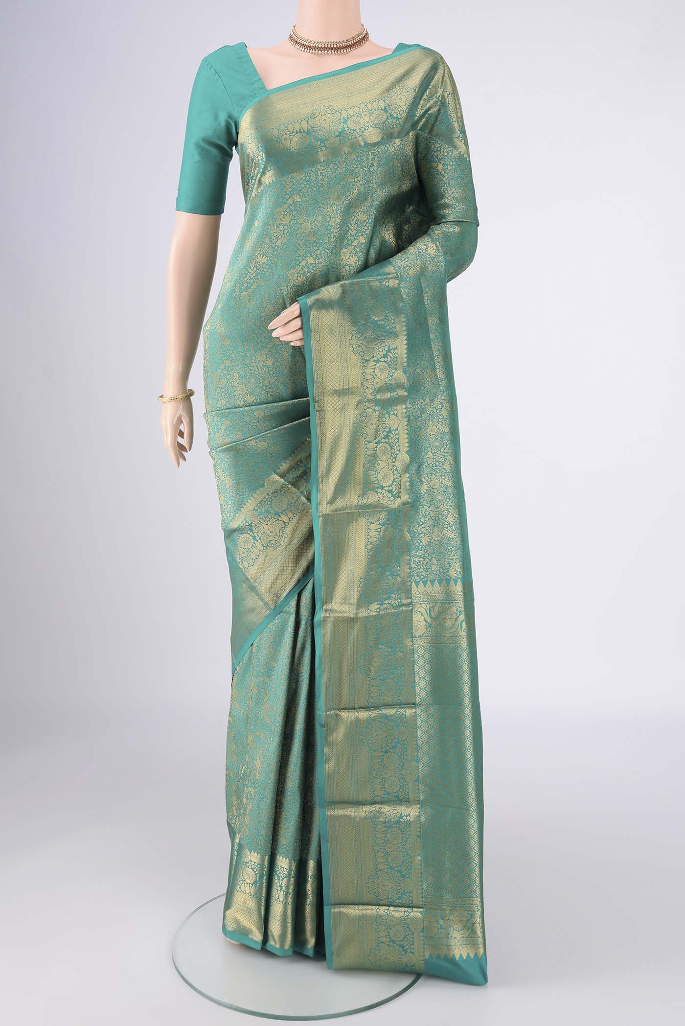 Sea Green Bangalore Silk Saree with Zari Brocade on the body and Zari Border.  displayed on a mannequin
