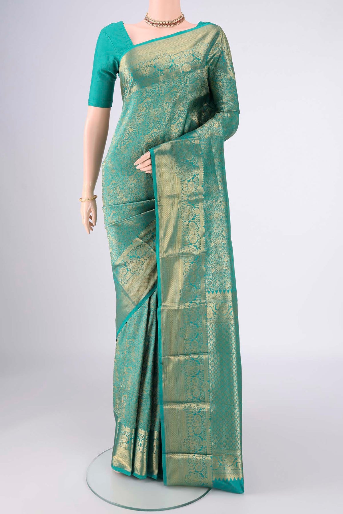 Sea Green Bangalore Silk Saree with Zari Brocade on the body and Zari Border.  displayed on a mannequin