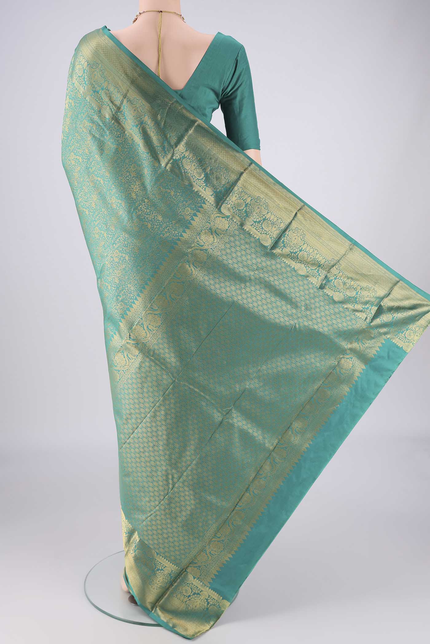 Flat view of Sea Green Bangalore Silk Saree with Zari Brocade on the body and Zari Border. 