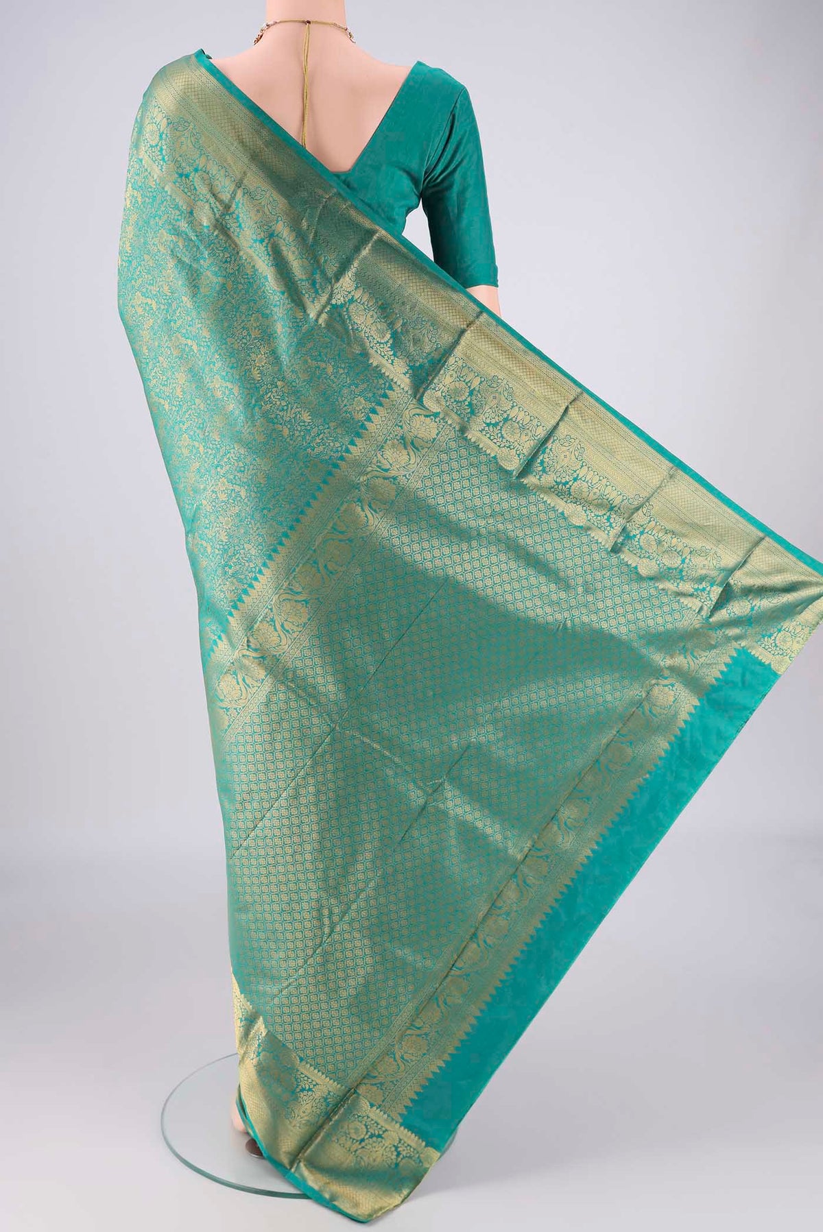 Flat view of Sea Green Bangalore Silk Saree with Zari Brocade on the body and Zari Border. 