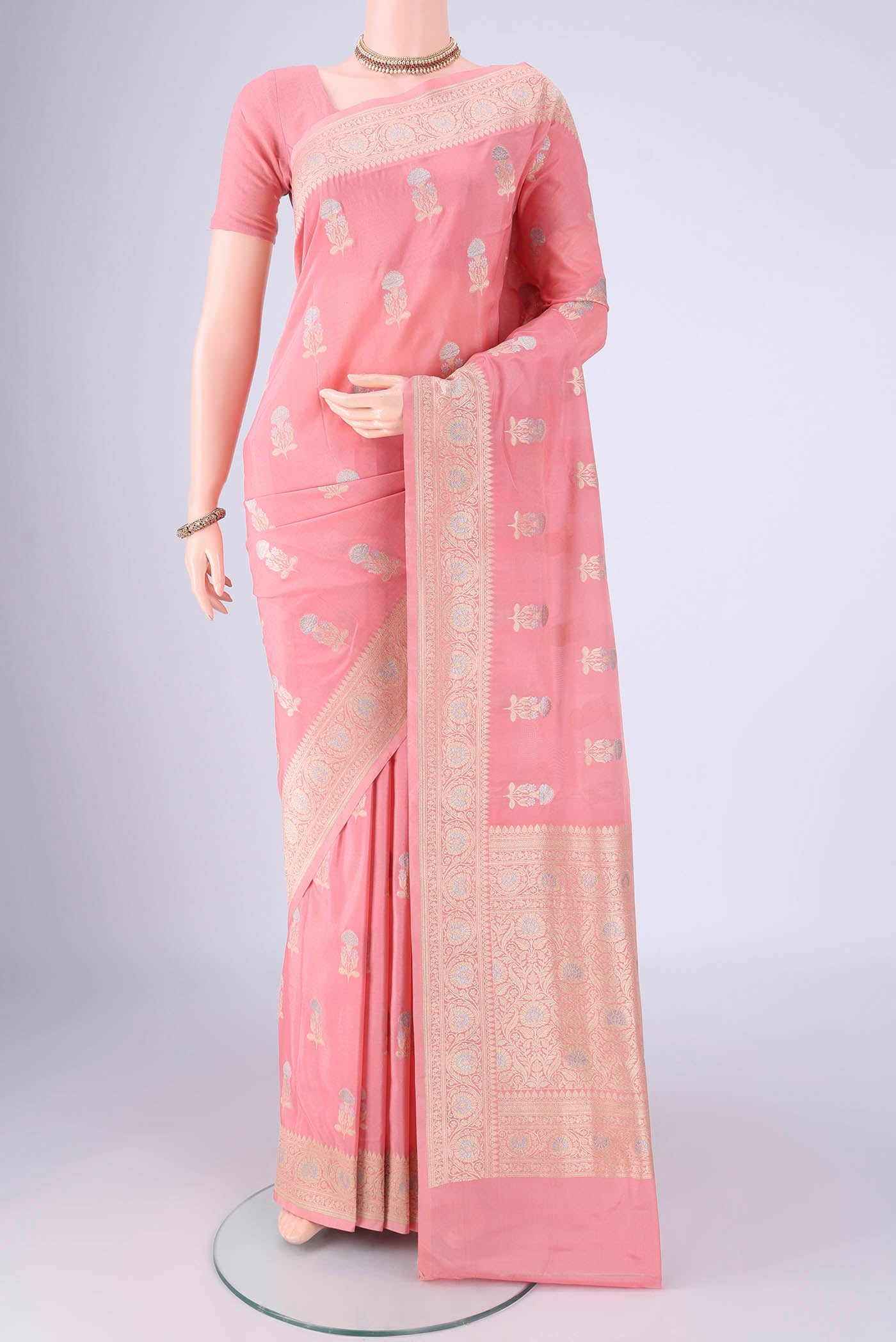 Rose pink Banarasi Silk Saree with Zari Butta on the body and Zari Border.  displayed on a mannequin