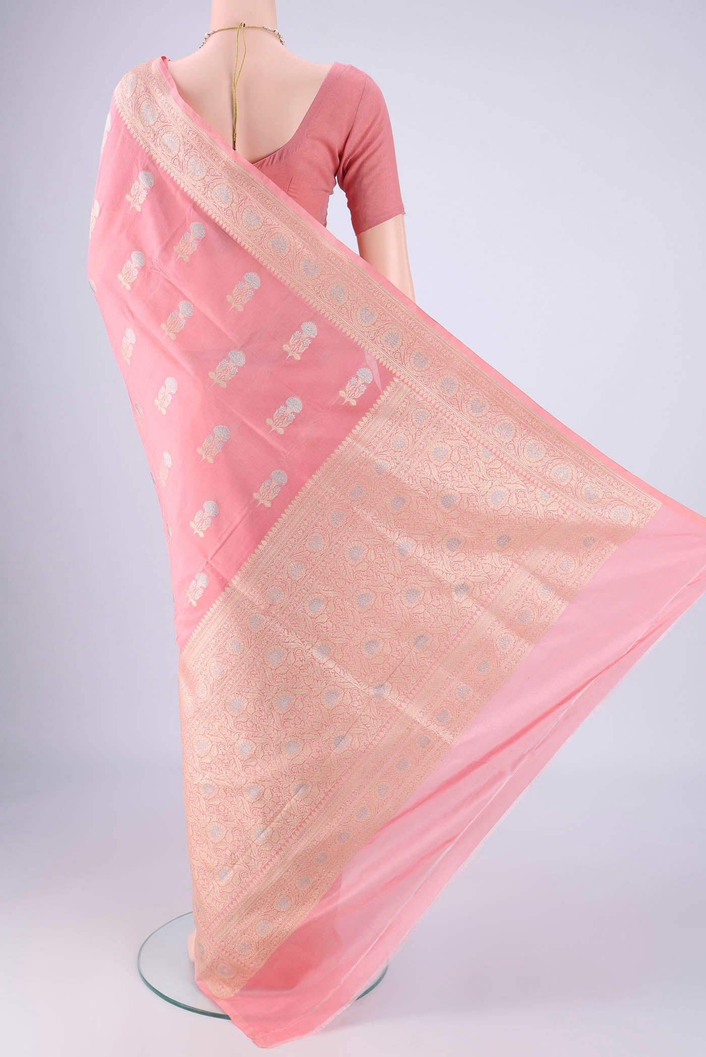 Flat view of Rose pink Banarasi Silk Saree with Zari Butta on the body and Zari Border. 