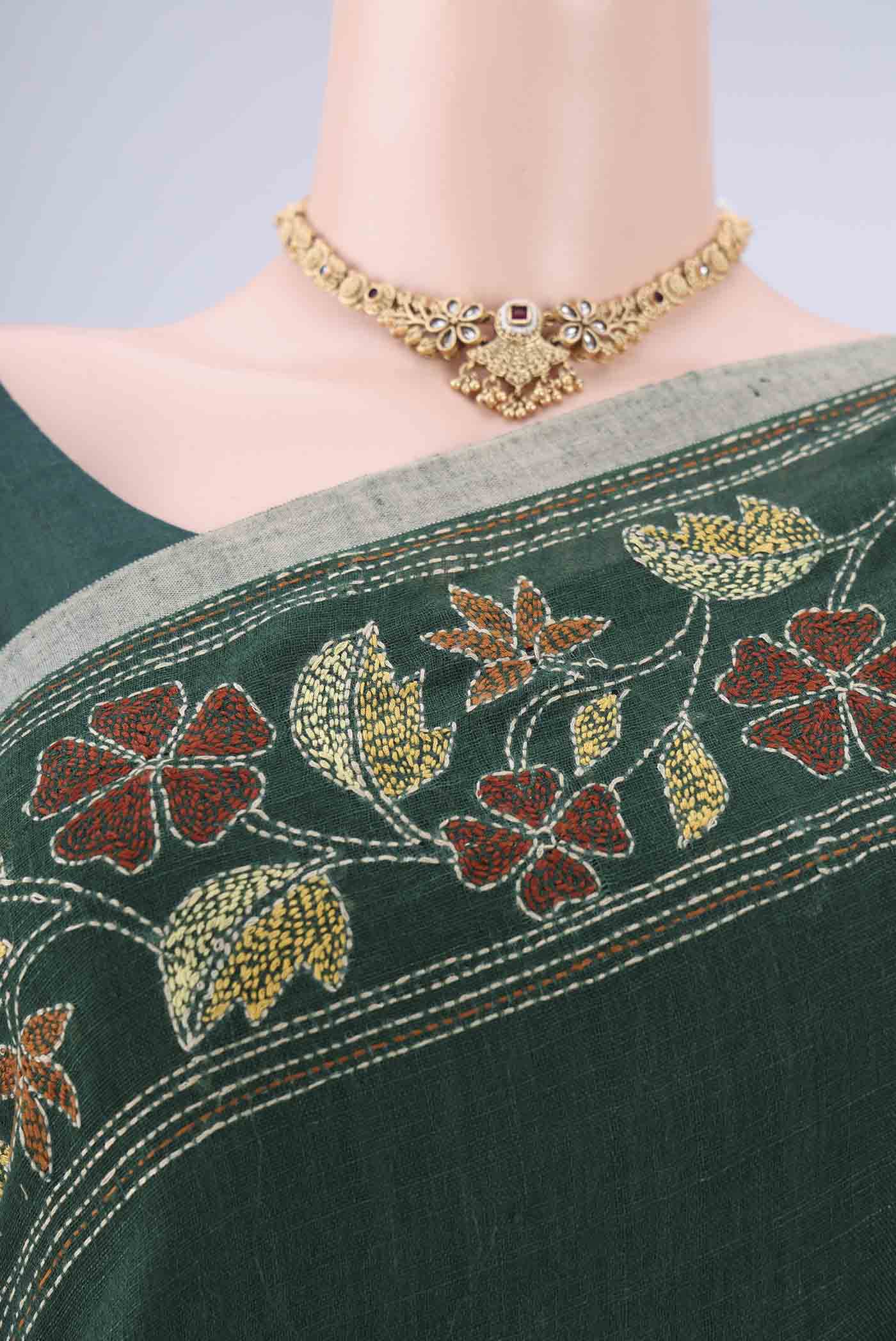 Border image of Bottle Green Linen Cotton Saree with Kantha Work on the body and Thread Border. 