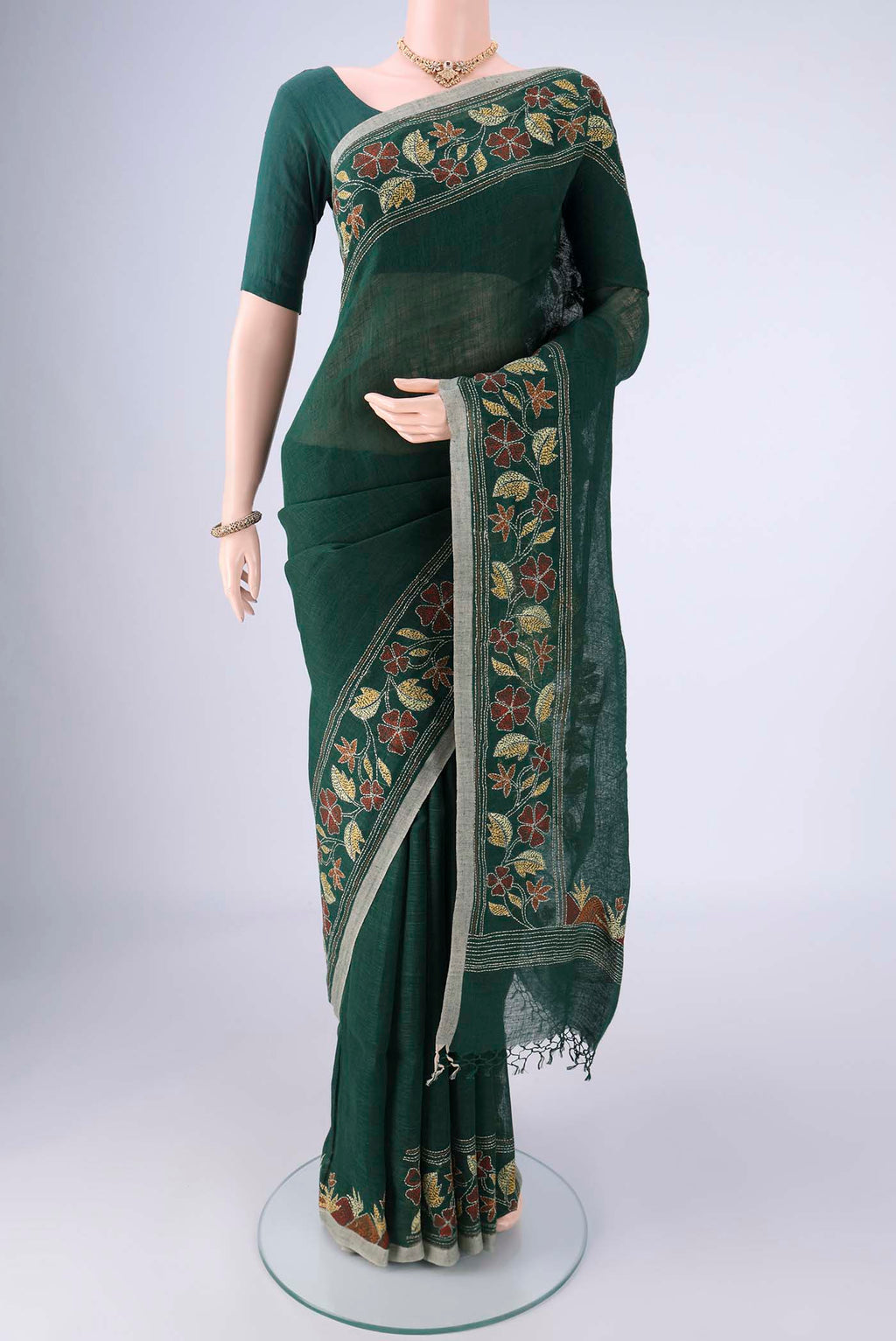 Bottle Green Linen Cotton Saree with Kantha Work on the body and Thread Border.  displayed on a mannequin